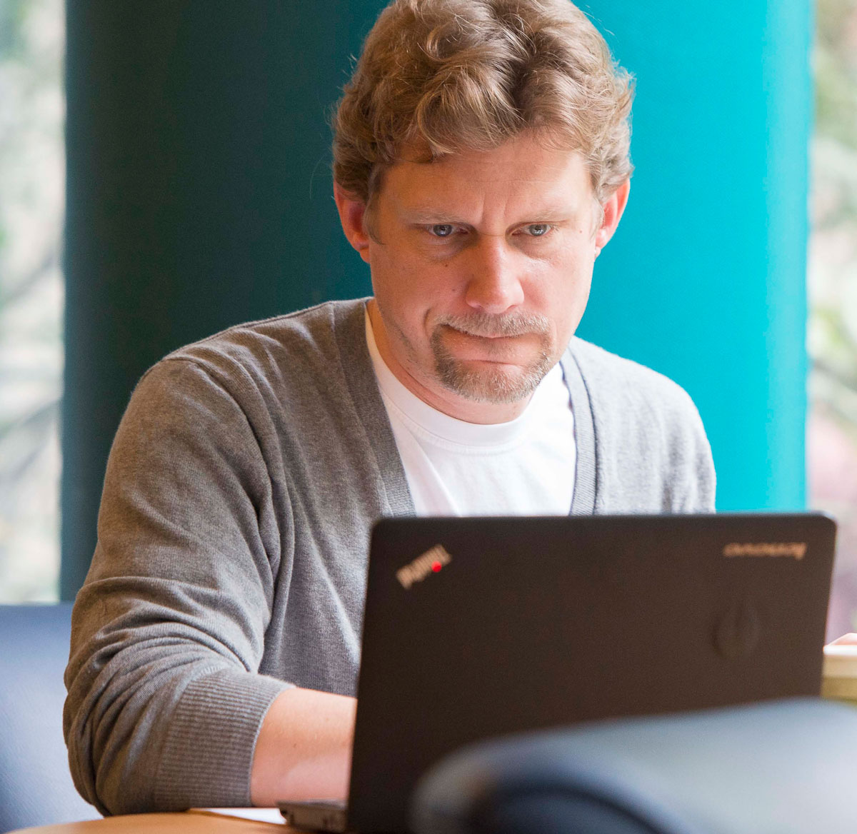 Man sitting at desk working on computer