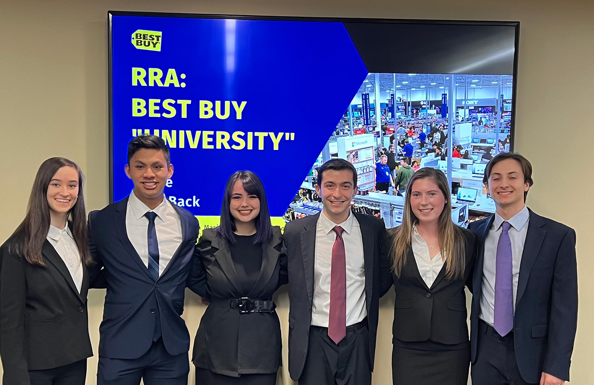 A photograph of six Fordham Gabelli School students within the Consulting Cup team proposed a plan to attract Gen Z consumers to Best Buy and expand the tech giant's social impact