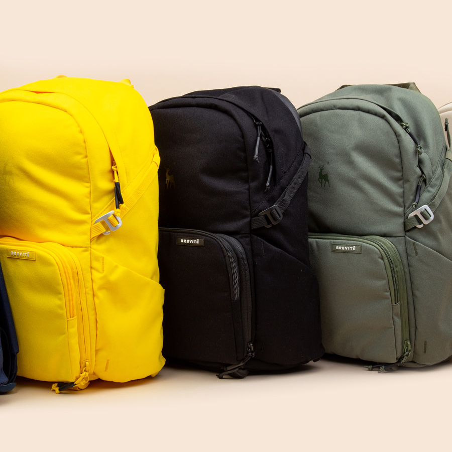 yellow, black, and green backpacks
