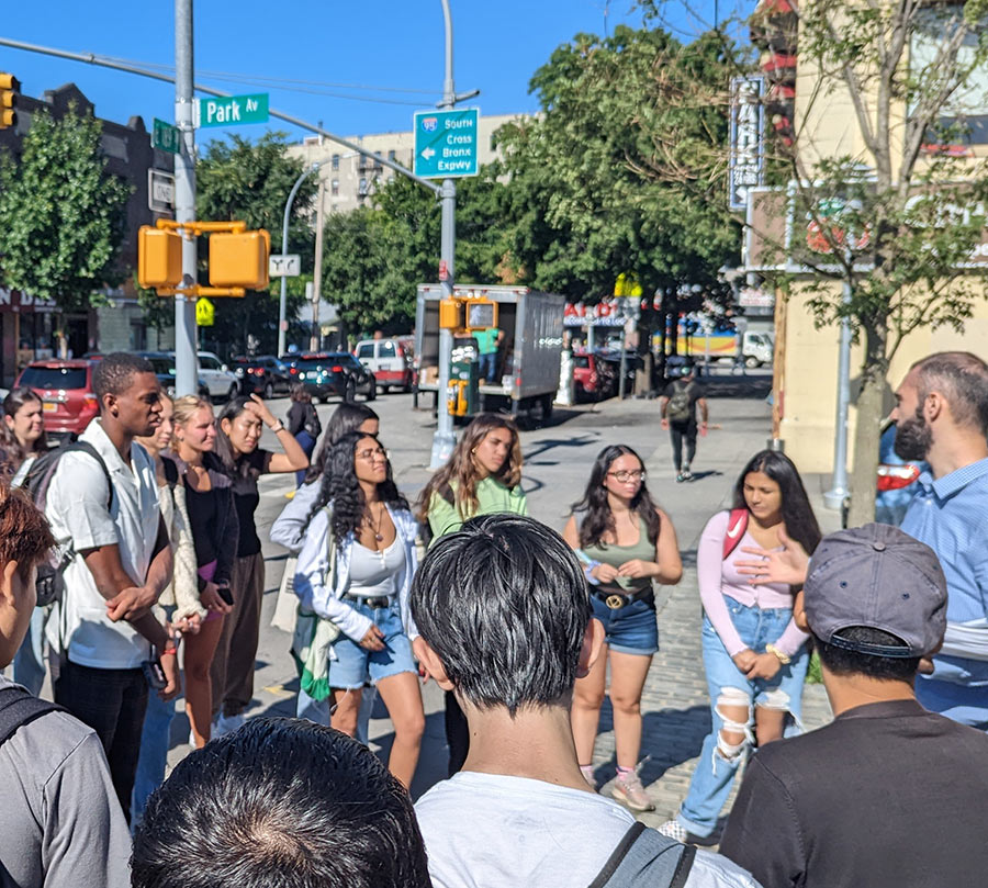 Students during a walk-through of the Fordham Road Business Improvement District 