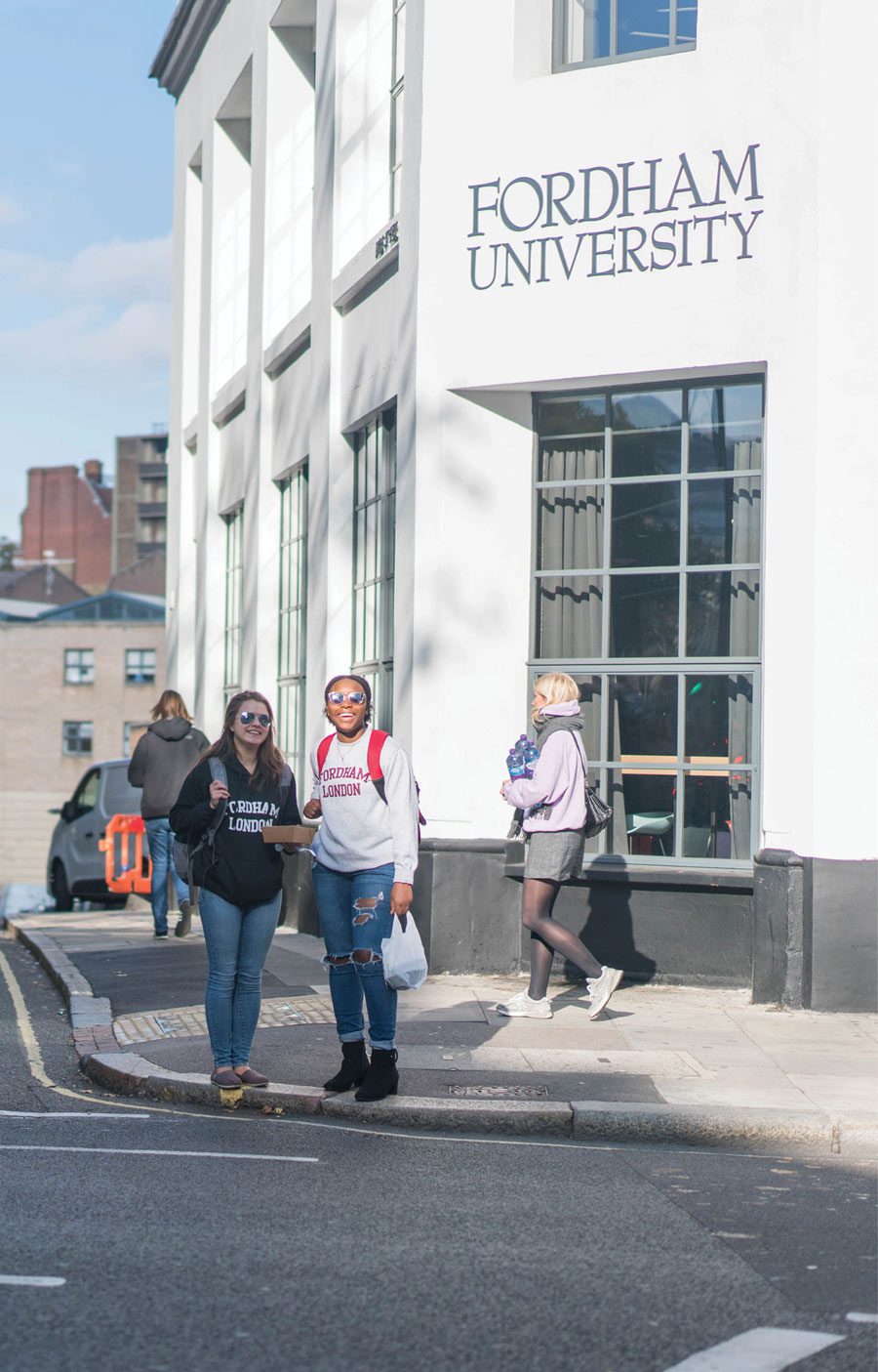 Students stand outside the Fordham London campus building.
